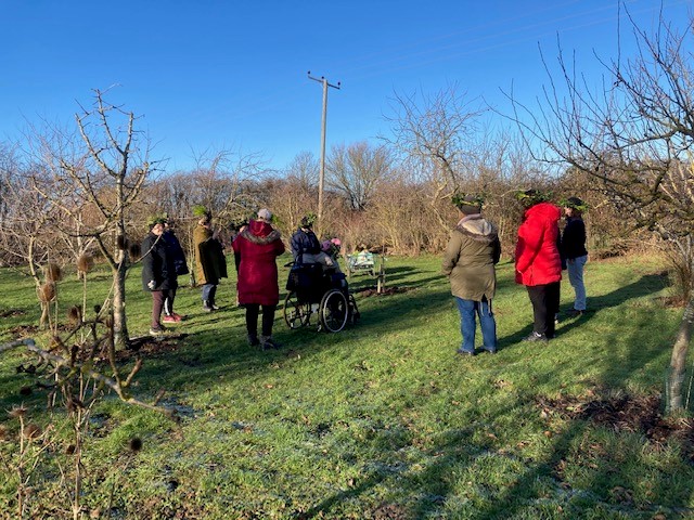 Group in orchard at a wassail. Darwin Nursery with permission.