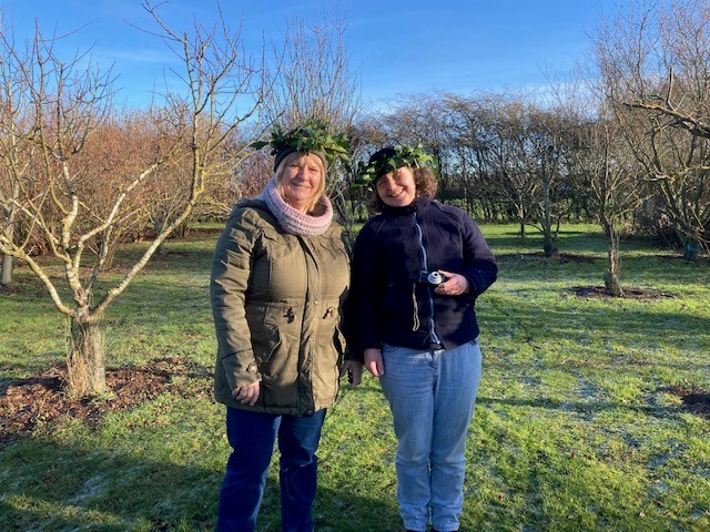 Celebrating a wassail in an orchard. Darwin Nursery with permission.